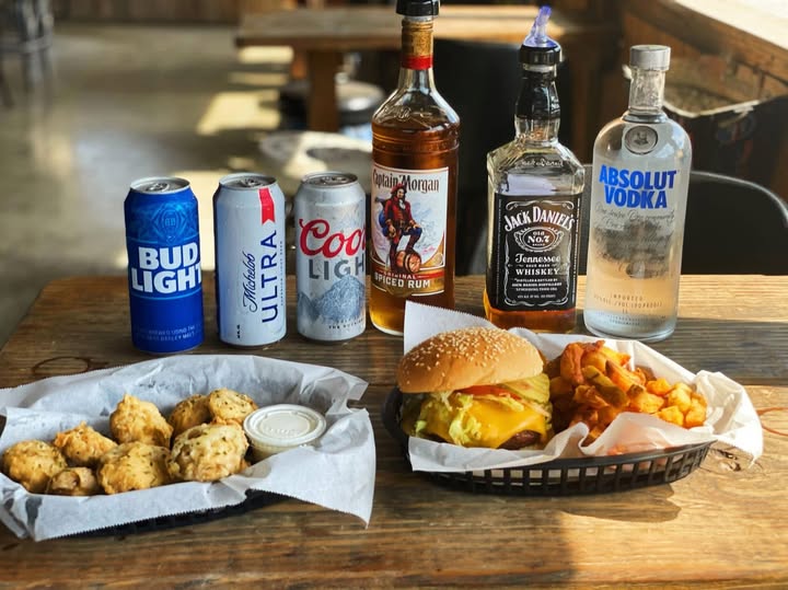 Burger and fried mushrooms with beers and spirits