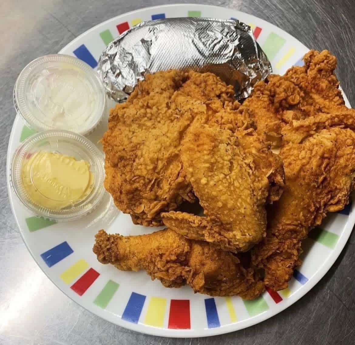Fried chicken dinner with baked potato