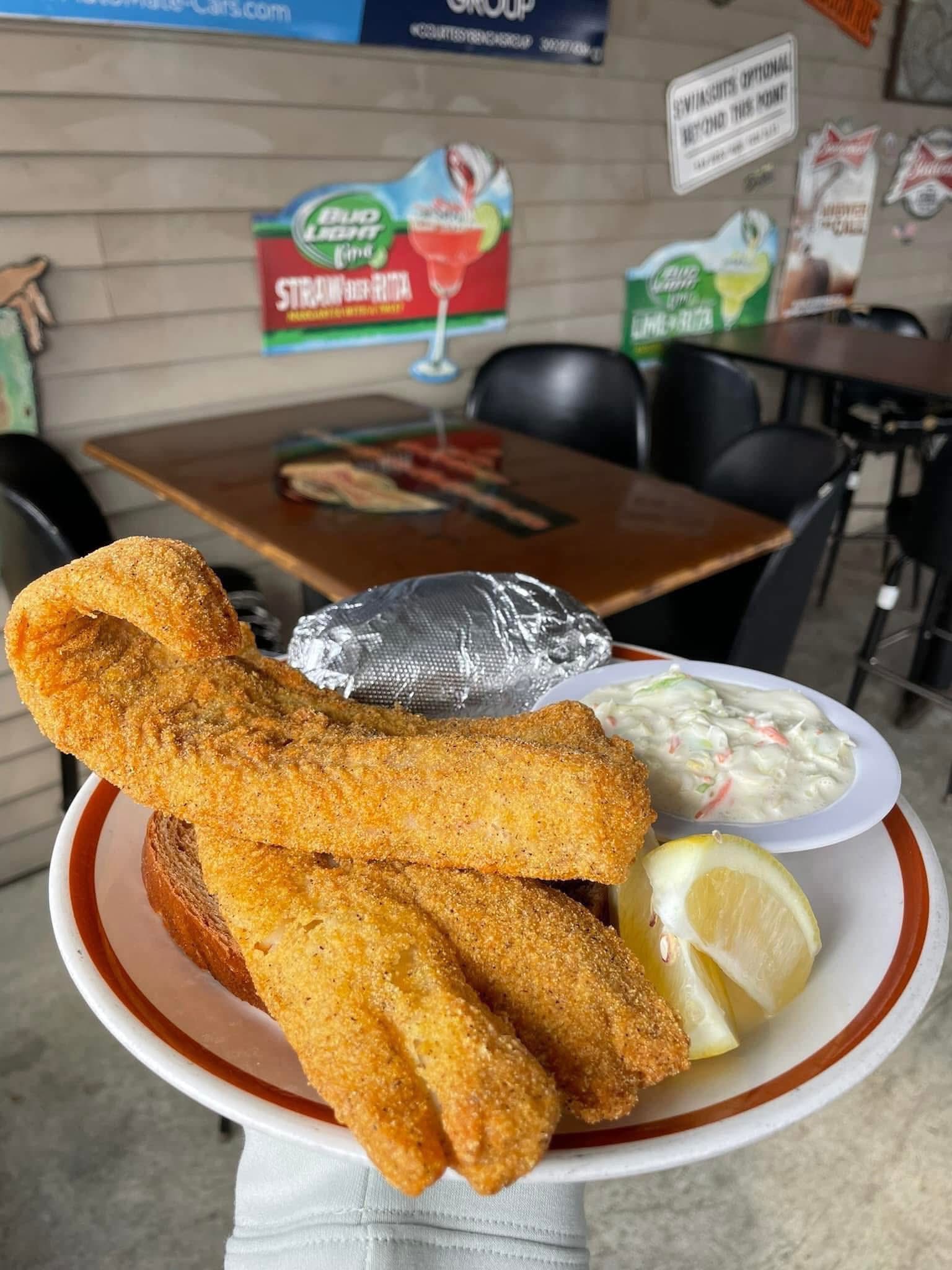 Fried walleye with baked potato and cole slaw