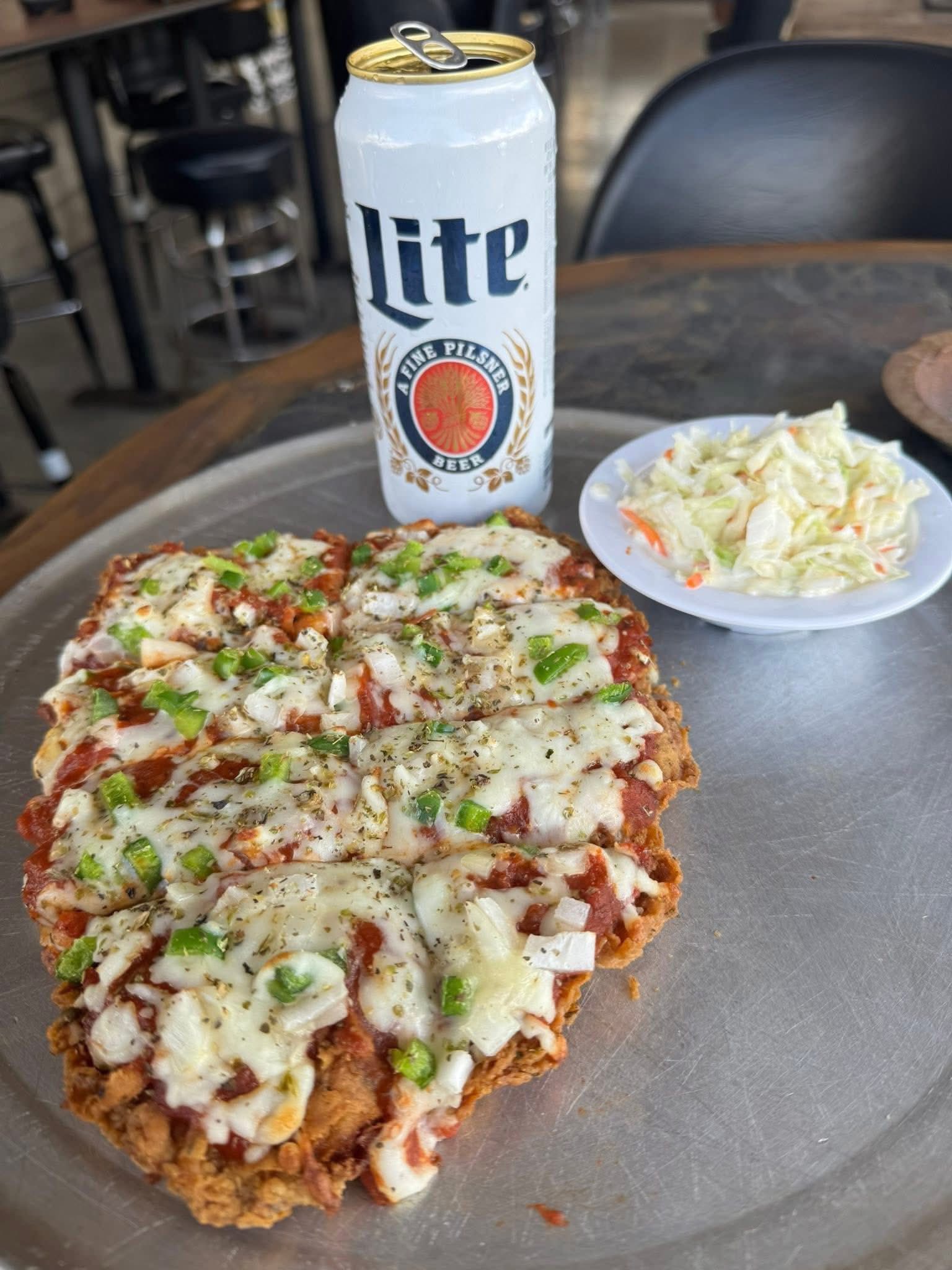Tenderloin pizza with green peppers and cole slaw